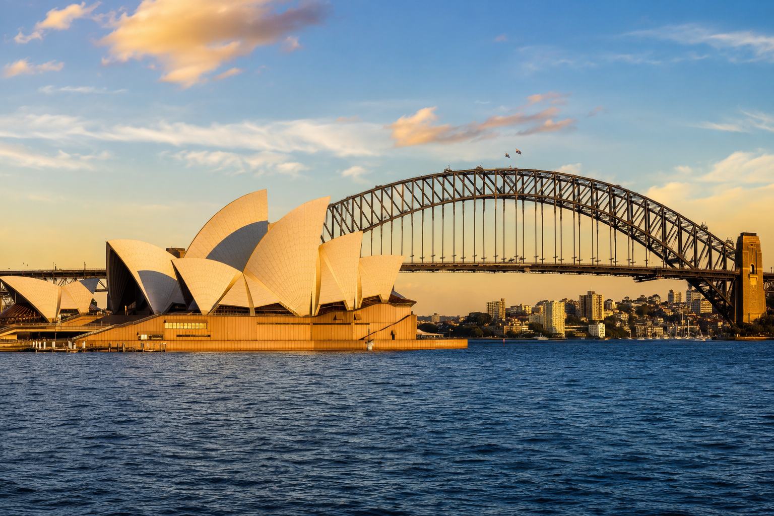 The Sydney Opera House and Sydney Harbour Bridge at golden hour